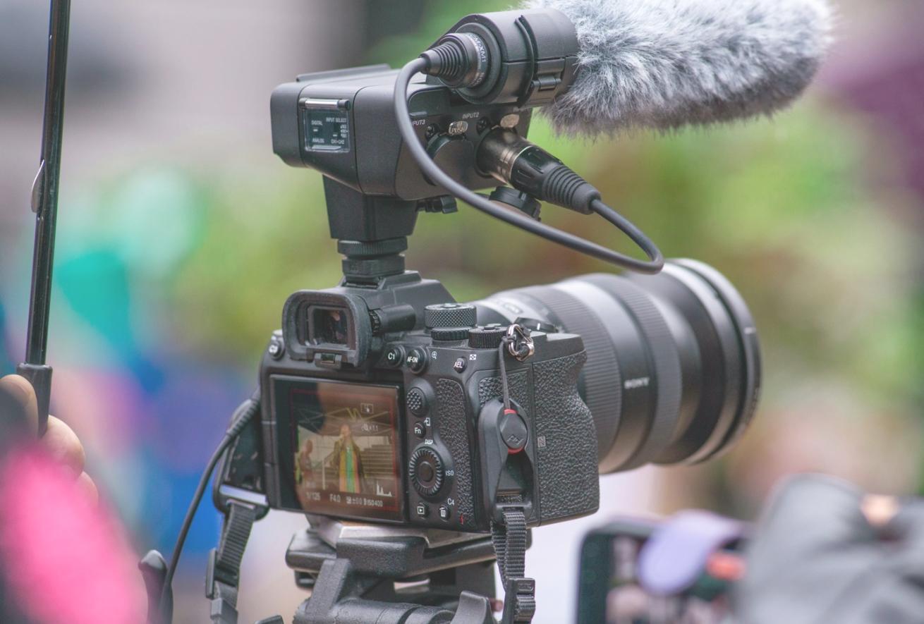 Students working in a modern news reporting environment